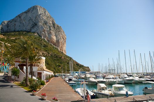 Calpe Alicante marina boats with Penon de Ifach mountain in Mediterranean sea of Spain