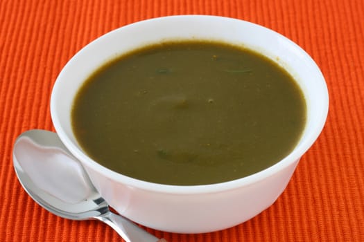 spinach soup in white bowl