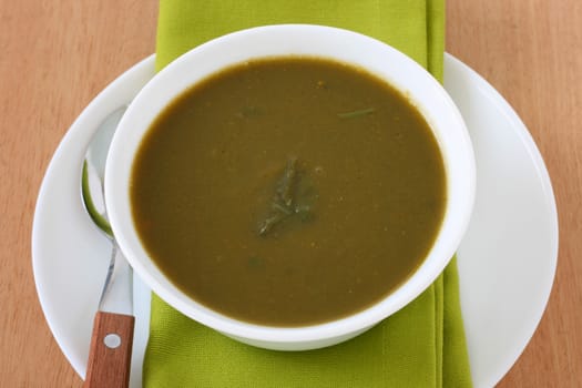 spinach soup in white bowl