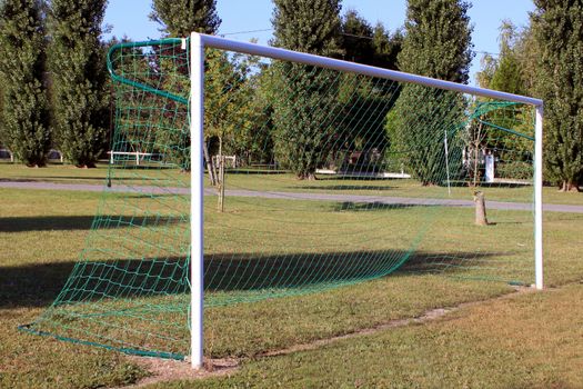 goal with a football field on nature background