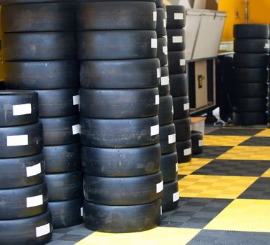 Formula One 1 race tires and wheels in boxes