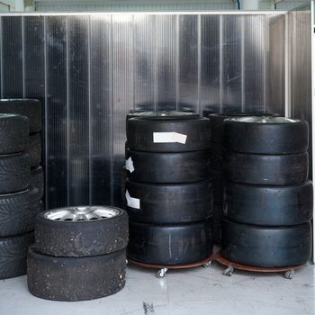 Formula One 1 race tires and wheels in boxes