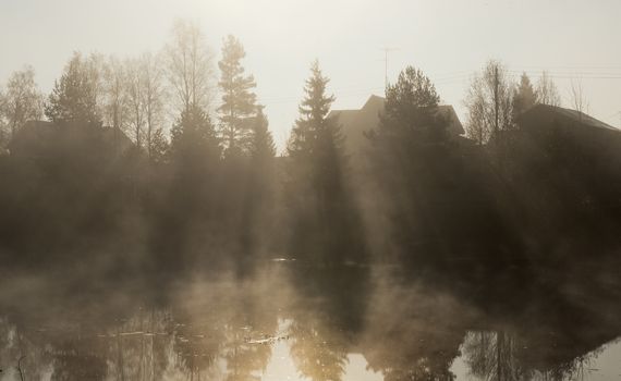 Early foggy morning on the river. Summer 