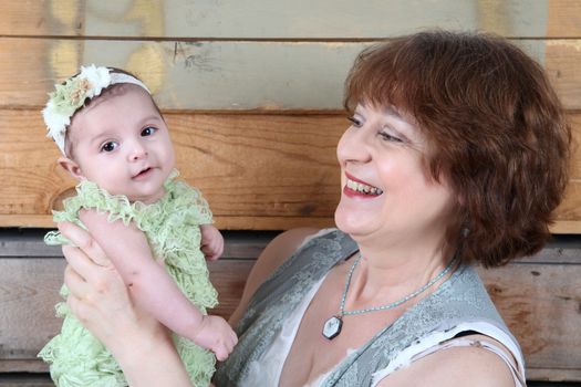 Grandmother with a three month old baby girl