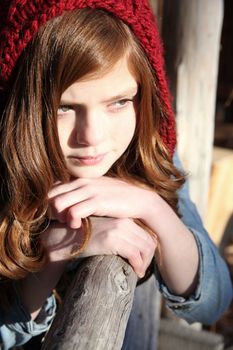 Teen winter girl wearing a red hat