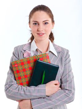 Portrait of university girl holding books and smiling. Isolated over white background.