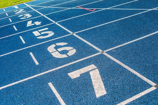 background of the start line of blue running tracks