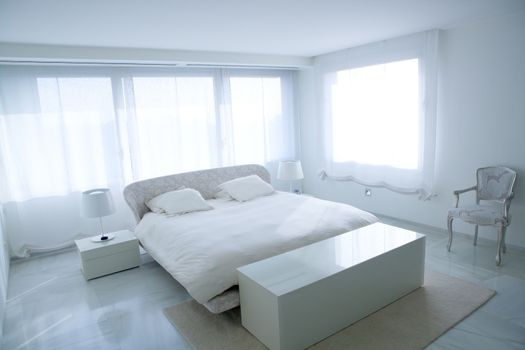 Modern white house bedroom with marble floor and luminous windows