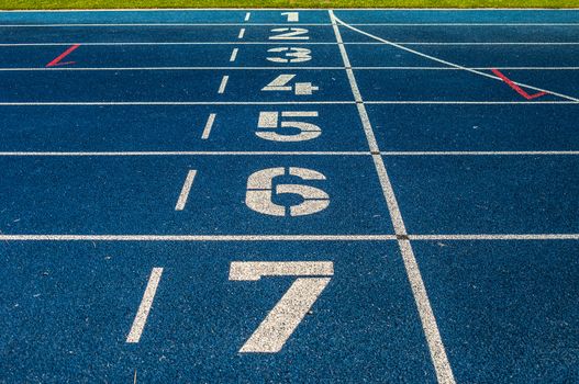 background of the start line of blue running tracks