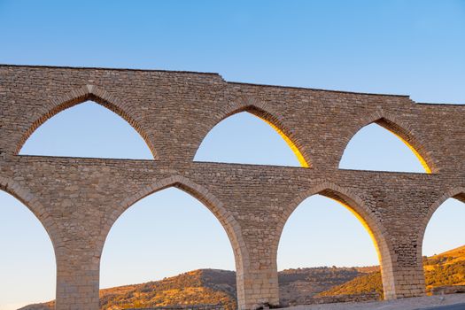 Morella aqueduct in Castellon Maestrazgo at Spain blue sky