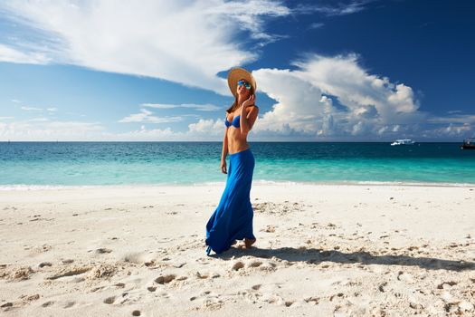 Woman in skirt at tropical beach