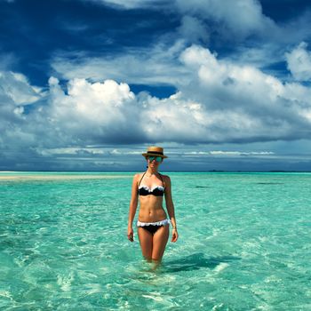 Woman in bikini at tropical beach