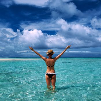 Woman in bikini at tropical beach