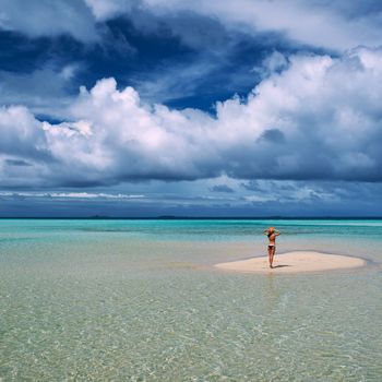 Woman in bikini at tropical beach