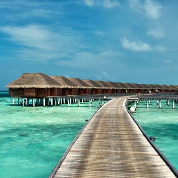 Beautiful beach with water bungalows at Maldives