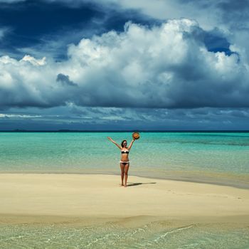 Woman in bikini at tropical beach