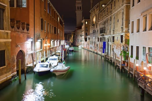 View of beautiful Venetian canal at night, Venice, Italy