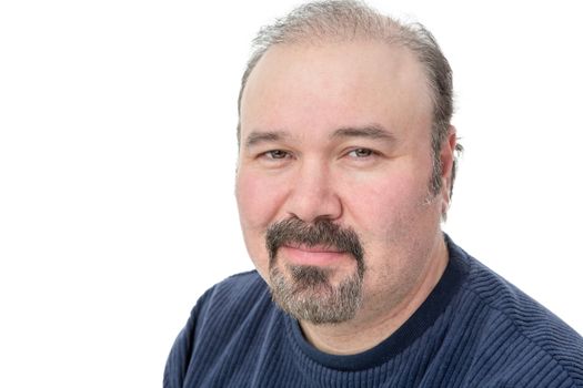 Closeup portrait of a middle-aged man with a speculative look looking pensively at the camera isolated on white