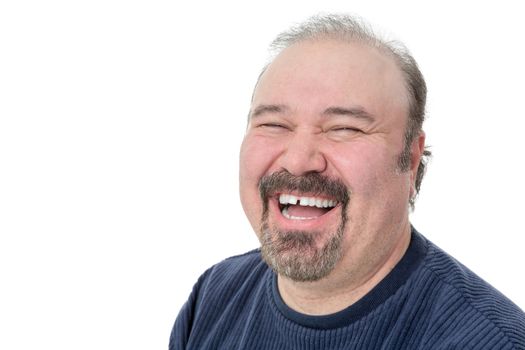 Close-up portrait of a funny mature man laughing hard on a white background