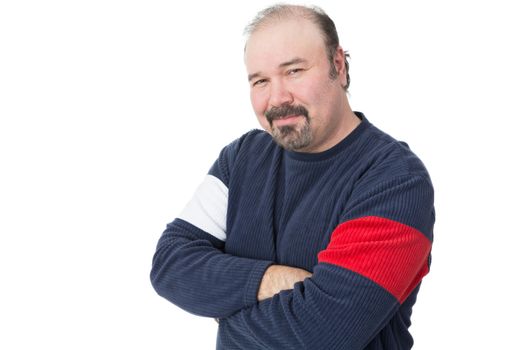 Portrait of a balding mature man with arms crossed on a white background