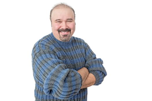 Portrait of a smiling mature man with arms crossed on a white background