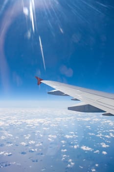 Beautiful view of  airplane wing on blue sky background