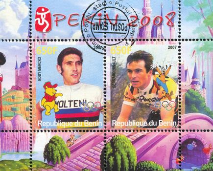 BENIN - CIRCA 2007: stamp printed by Benin, shows Eddy Merckx, Disney Caharacter and Olympic Rings, circa 2007