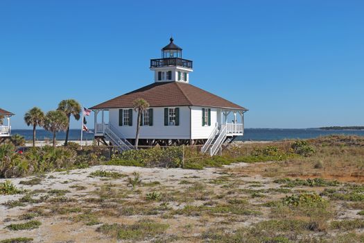 The Port Boca Grande Lighthouse on Gasparilla Island, Florida against a bright blue sky