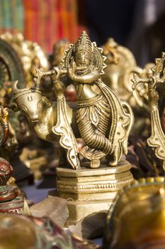 idol lord krishna statue in metallic and standing and playing his flute