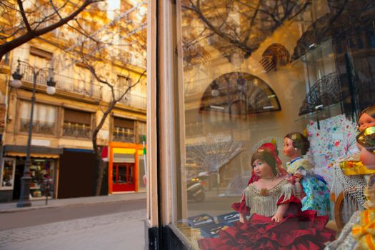 Valencia Calle san Vicente with Falleras dolls and spanish fan in Spain