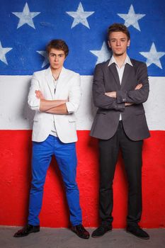 Young cool teenagers boy on American flag background.