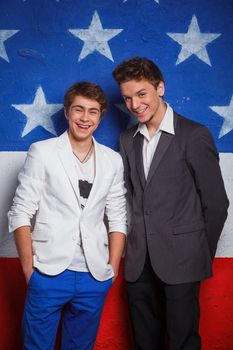 Studio portrait of young cool teenagers boy on American flag background.