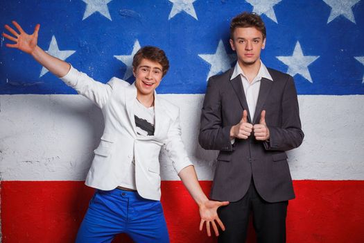 Studio portrait of young cool teenagers boy on American flag background.