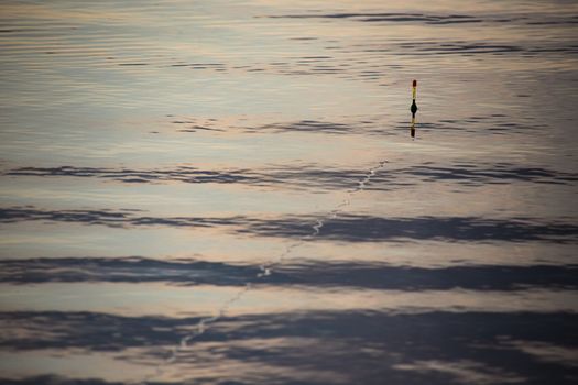 The fishing float in the cristal water