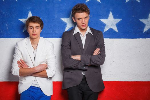 Studio portrait of young cool teenagers boy on American flag background.