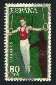 SPAIN - CIRCA 1960: stamp printed by Spain, shows Athlete with rings, circa 1960