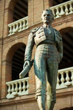 Plaza de toros de Valencia bullring with toreador statue of Manolo Montoliu