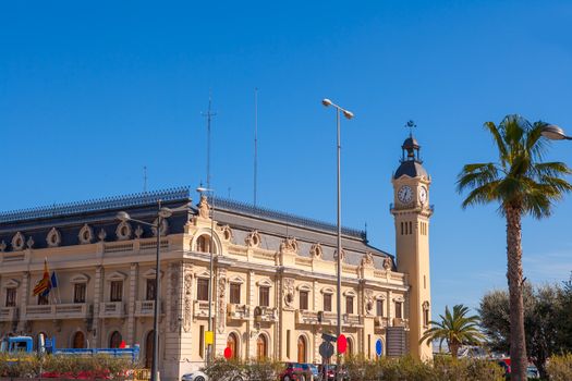 Valencia Port building with tower and palm tree in Mediterranean Spain