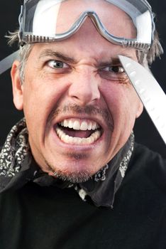 Close-up of a crazy man attacking with a knife.