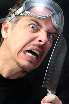 Close-up of a crazy man with a knife.