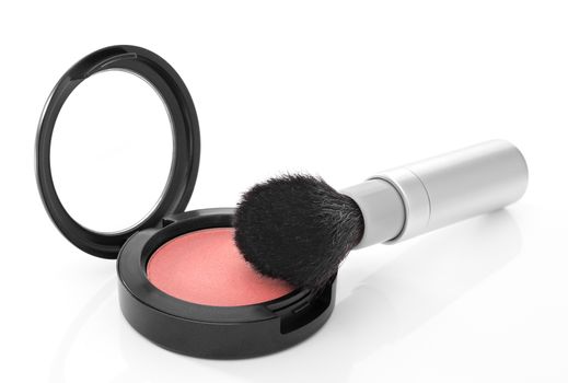 Pink shimmer blush and makeup brush, isolated on white background.