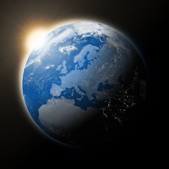 Sun over Europe on blue planet Earth isolated on black background. Elements of this image furnished by NASA.