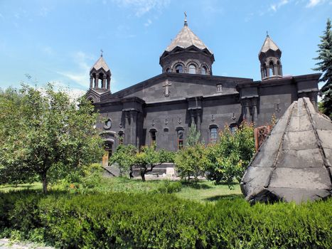 The Yot Verk (Seven Wounds) Church is located in Gyumri, Armenia. The construction of the church started in 1873 and ended in 1884. The battered and worn roof cones that stand outside are from an earlier incarnation of the church that was destroyed in an earthquake