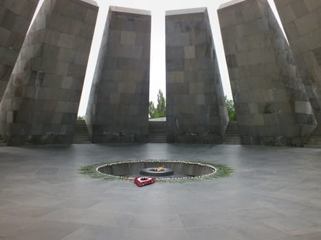 The Sanctuary of Eternity consists of 12 slabs positioned in a circle surrounding the eternal flame which is usually surrounded by floral tributes.