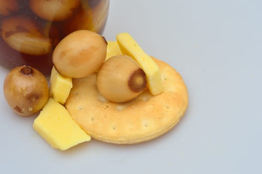 close up of cheese biscuits and pickled onions