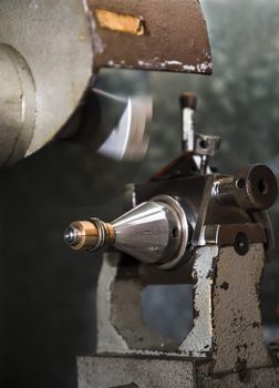 Close up of machining a golden ring