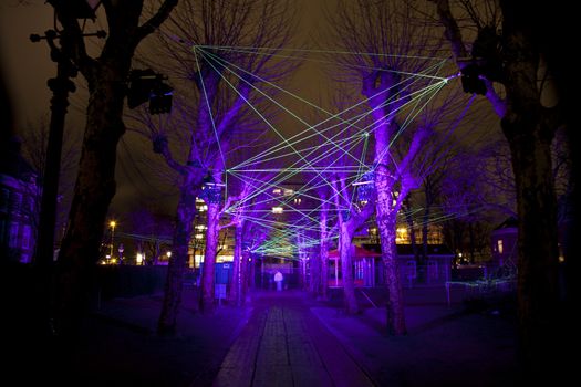 AMSTERDAM, THE NETHERLANDS: Laser show with lights at annual Amsterdam Light Festival on December 30, 2013. Amsterdam Light Festival is a winter light festival  