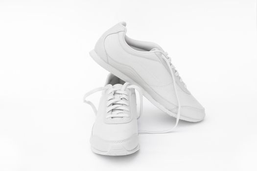 A pair of white running shoes
