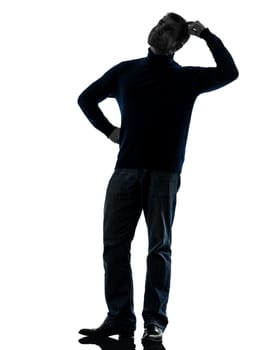 one caucasian man doubtful thinking full length in silhouette studio isolated on white background