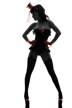 one sexy caucasian woman stripper showgirl  in silhouette studio isolated on white background